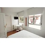 ** Comillas